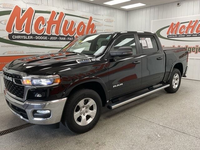 2025 RAM 1500 Big Horn Crew Cab 4x4 5'7' Box in Diamond Black Crystal Pearlcoat — front three-quarter view