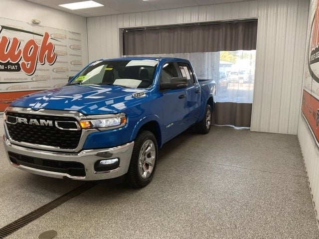 2025 RAM 1500 Big Horn Crew Cab 4x4 5'7' Box in Hydro Blue Pearlcoat — front three-quarter view