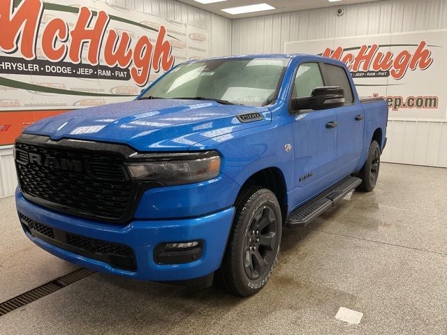 2026 RAM Ram 1500 RAM 1500 BIG HORN CREW CAB 4X4 5'7' BOX in Hydro Blue Pearl-Coat Exterior Paint — front three-quarter view