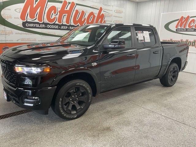2026 RAM 1500 Big Horn Crew Cab 4x4 5'7' Box in Diamond Black Crystal Pearlcoat — front three-quarter view