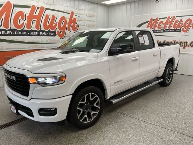 2025 RAM 1500 Laramie Crew Cab 4x4 5'7' Box in Bright White Clearcoat — front three-quarter view