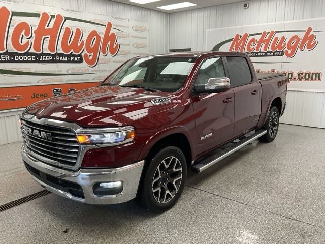 2025 RAM 1500 Laramie Crew Cab 4x4 5'7' Box in Delmonico Red Pearlcoat — front three-quarter view
