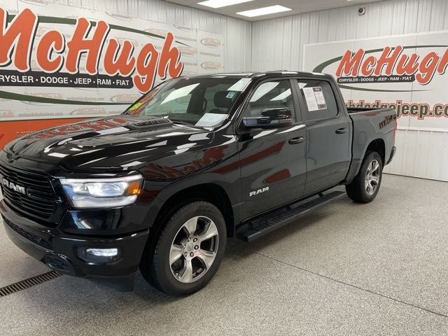 2023 RAM 1500 Laramie Crew Cab 4x4 5'7' Box in Diamond Black Crystal Pearlcoat — front three-quarter view