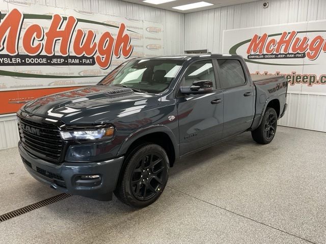 2026 RAM Ram 1500 RAM 1500 LARAMIE CREW CAB 4X4 5'7' BOX in Forged Blue Metallic Exterior Paint — front three-quarter view