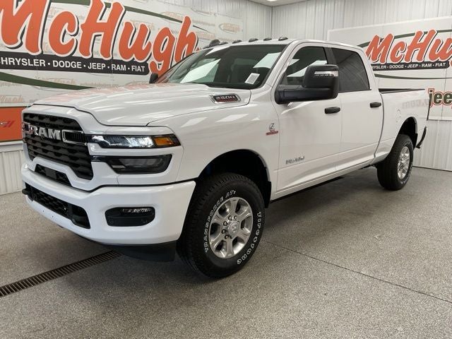 2026 RAM Ram 2500 RAM 2500 BIG HORN CREW CAB 4X4 6'4' BOX in Bright White Clear-Coat Exterior Paint — front three-quarter view
