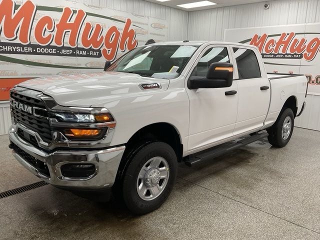 2026 RAM Ram 2500 RAM 2500 TRADESMAN CREW CAB 4X4 6'4' BOX in Bright White Clear-Coat Exterior Paint — front three-quarter view