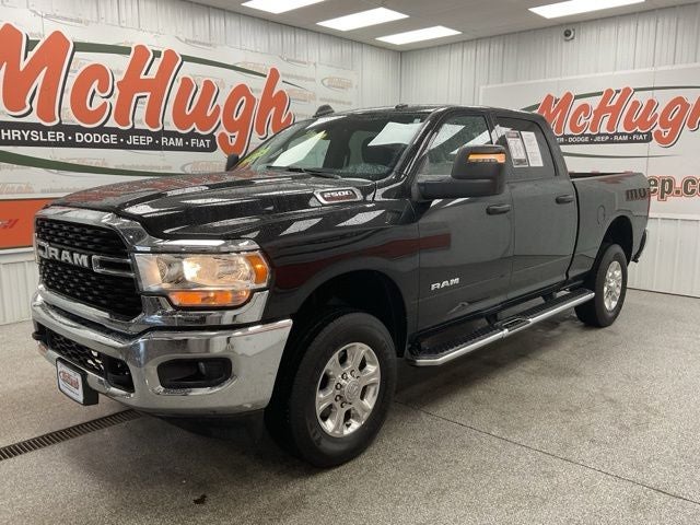 2024 RAM 2500 Big Horn Crew Cab 4x4 6'4' Box in Diamond Black Crystal Pearlcoat — front three-quarter view