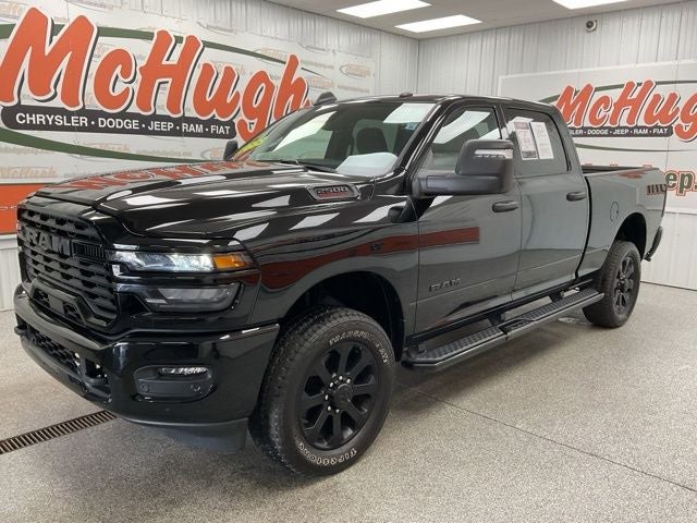2025 RAM 2500 Big Horn Crew Cab 4x4 6'4' Box in Diamond Black Crystal Pearlcoat — front three-quarter view