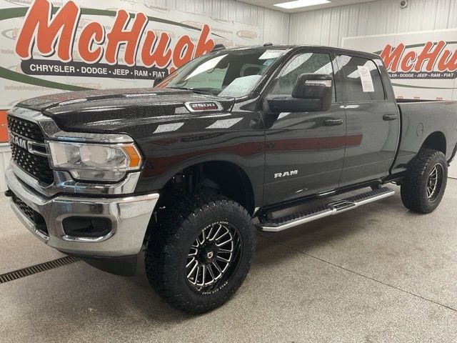 2024 RAM 2500 Big Horn Crew Cab 4x4 6'4' Box in Diamond Black Crystal Pearlcoat — front three-quarter view