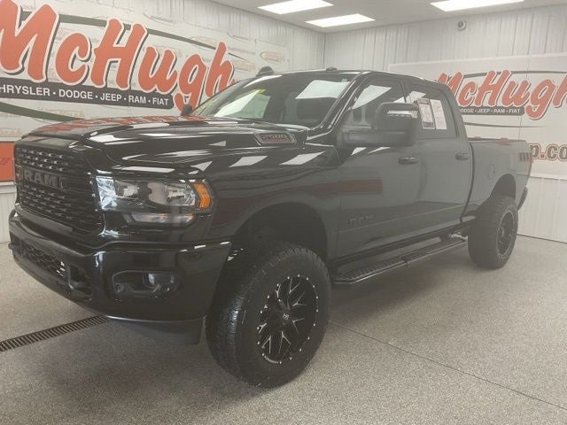 2024 RAM 2500 Big Horn Crew Cab 4x4 6'4' Box in Diamond Black Crystal Pearlcoat — front three-quarter view