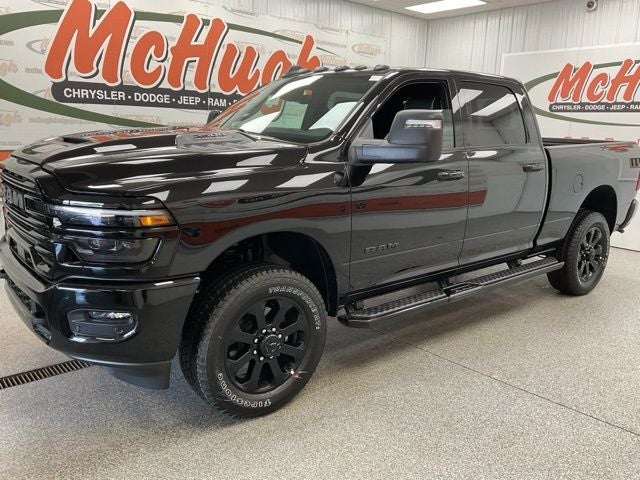2026 RAM Ram 2500 RAM 2500 LARAMIE CREW CAB 4X4 6'4' BOX in Diamond Black Crystal Pearl-Coat Exterior Paint — front three-quarter view